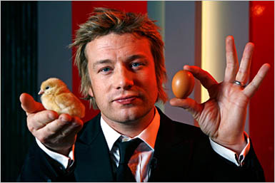 Chef holds a chick and an egg